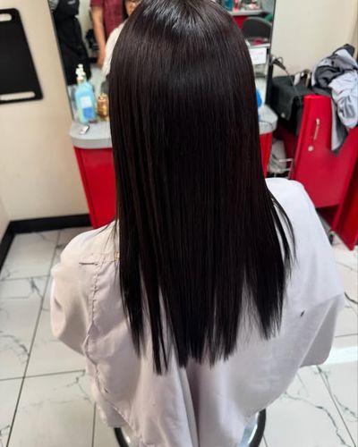 Sleek, straight dark lengths after a smoothing treatment