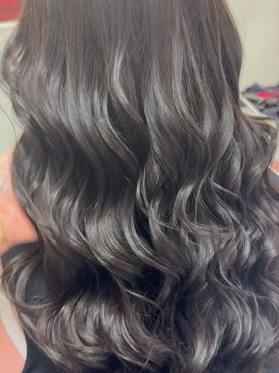 Glossy soft waves on long dark hair